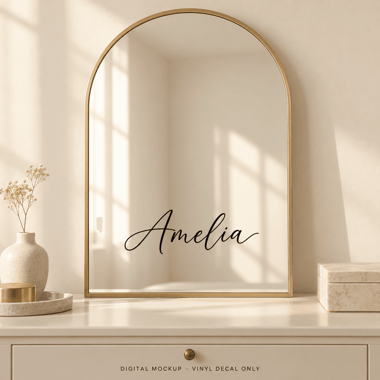 Digital mockup: Black script name "Amelia" on an arched mirror. Vinyl decal only; props are not included.